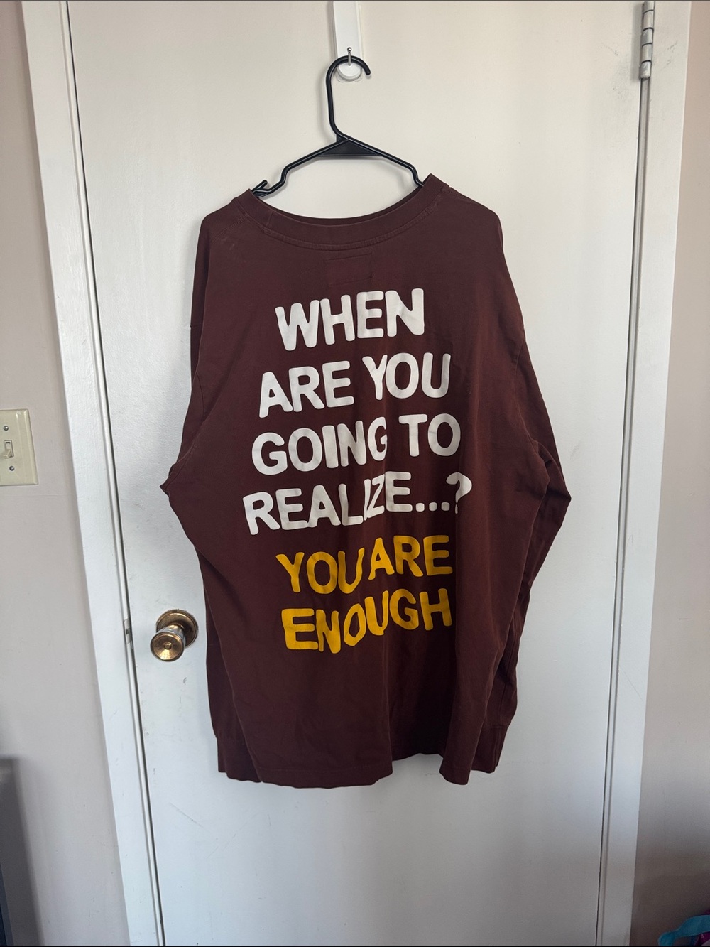 CHNGE Long Sleeve Tee in Brown with White and Yellow Text